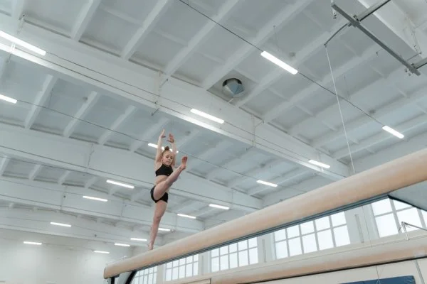 female gymnast balance beam routine